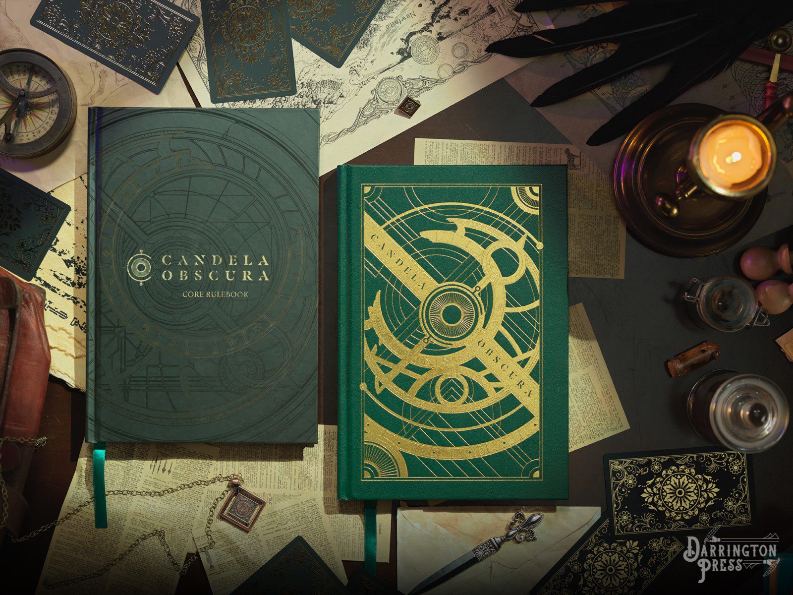 Two rulebooks, one with a black cover with concentric circle designs and gold lettering, and the other in green, with concentric circle designs in gold, with Candela Obscura in green.